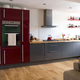 kitchen with red cabinet and worktop
