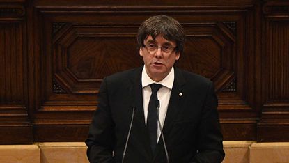 Catalan President Carles Puigdemont suspends declaration of independence