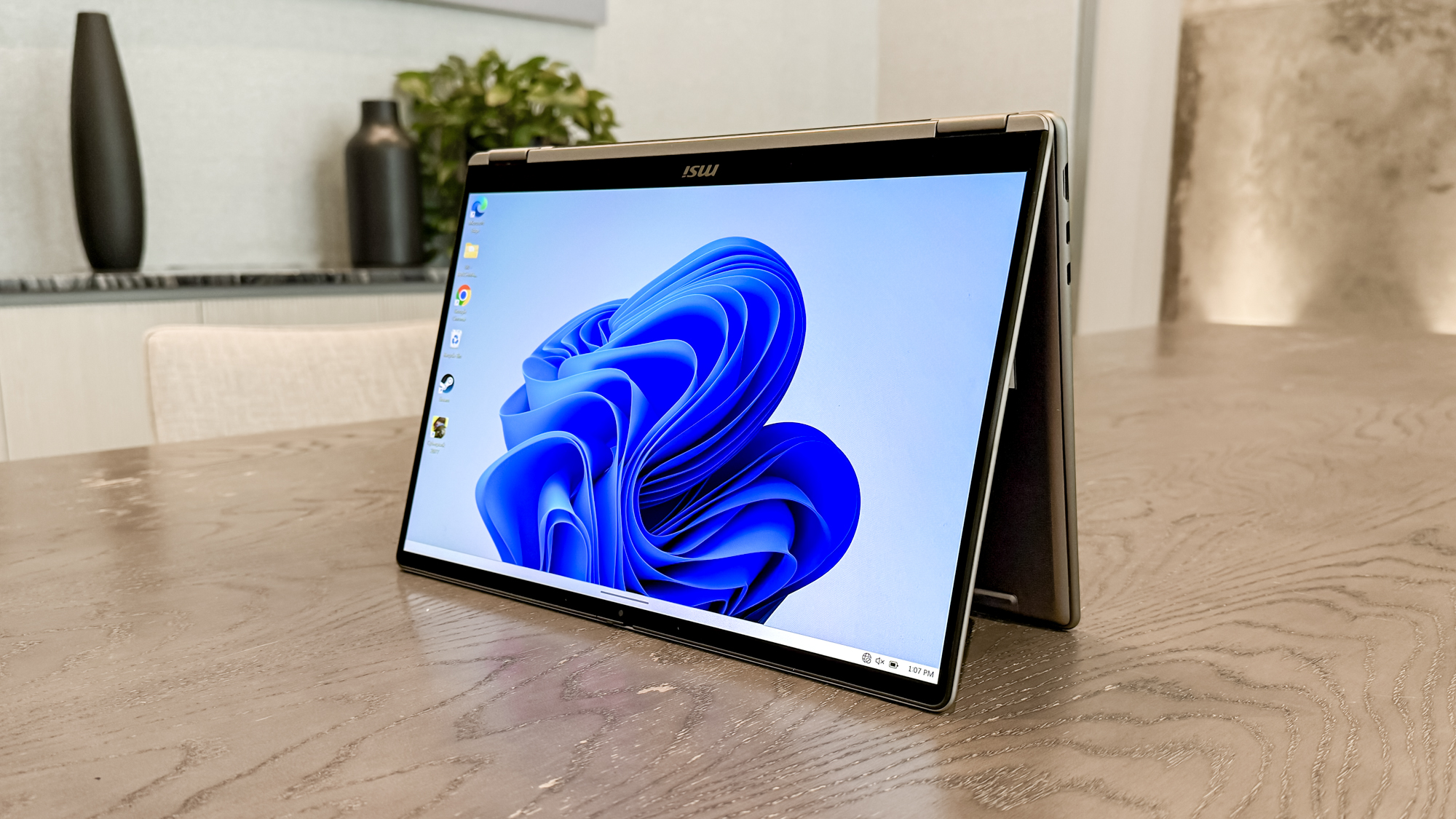 MSI Prestige 14 Flip AI+ in tent mode on a table