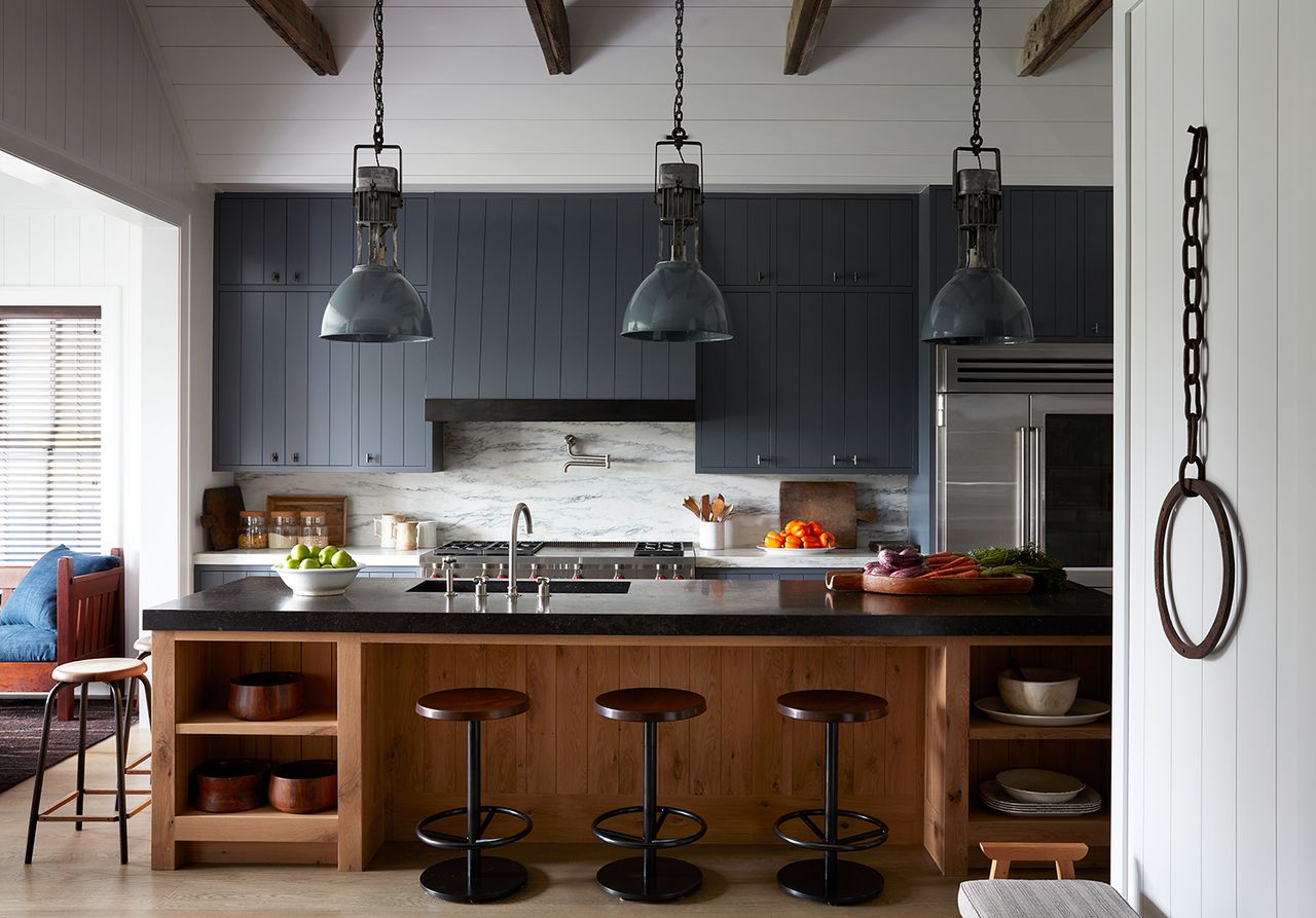 a kitchen with a tap to view refrigerator