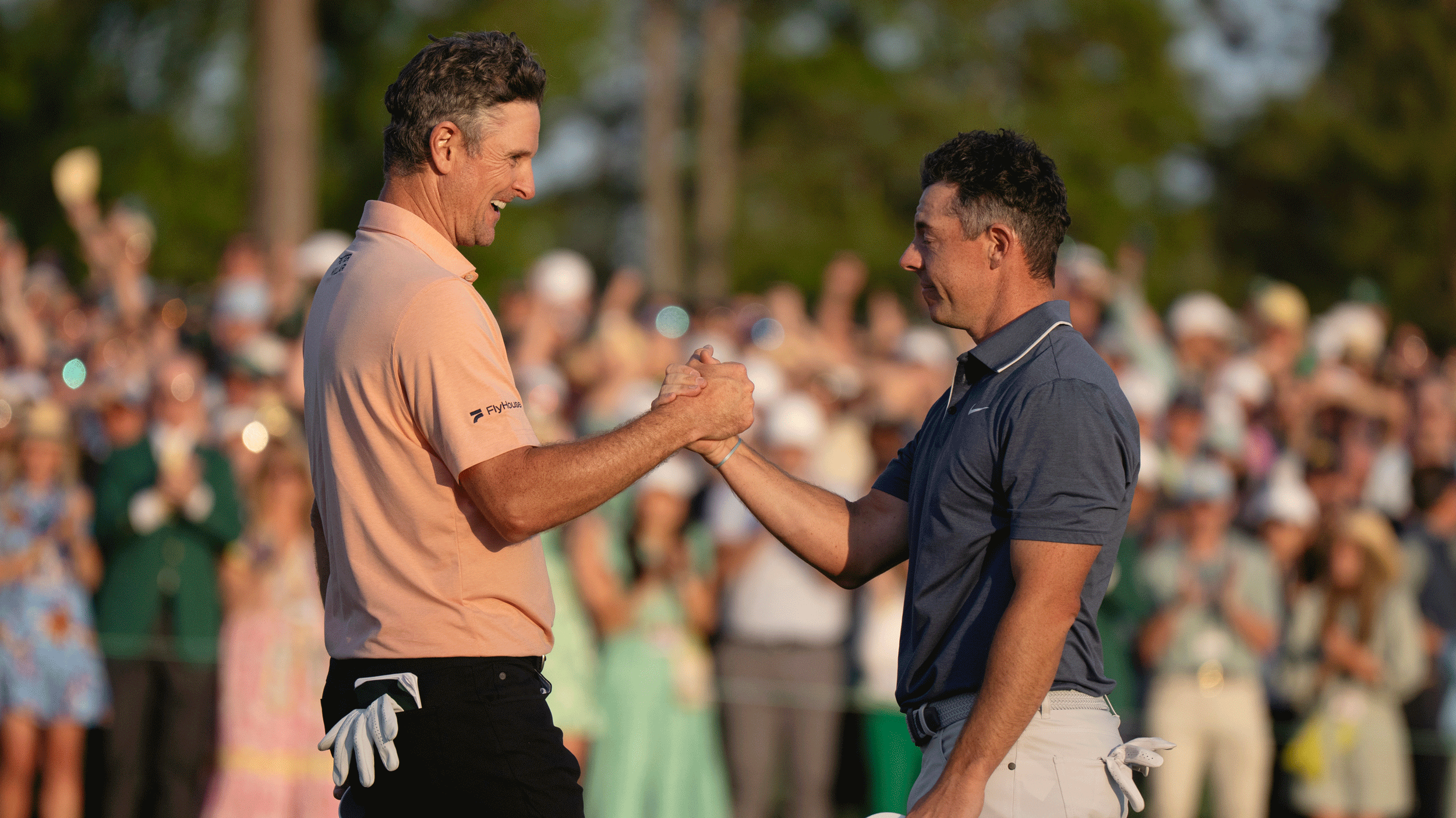 Justin Rose and Rory McIlroy shake hands after the Northern Irishman won the 2025 Masters