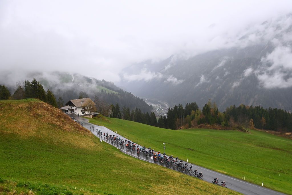 LIENZ AUSTRIA APRIL 22 Pello Bilbao Lpez De Armentia of Spain and Team Bahrain Victorious Green Leader Jersey with teammates lead the peloton passing through a mountain landscape at Assling 1126m during the 45th Tour of the Alps 2022 Stage 5 a 1145km stage from Lienz to Lienz TouroftheAlps on April 22 2022 in Lienz Austria Photo by Tim de WaeleGetty Images