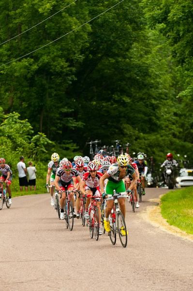 Reid Mumford (Kelly Benefit Strategies-OptumHealth) leads the main group over a small climb.