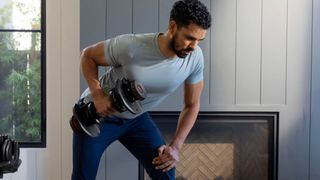 Man exercising with the Bowflex SelectTech 1090 adjustable dumbbell