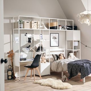 white bedroom with modular open storage, bed and desk