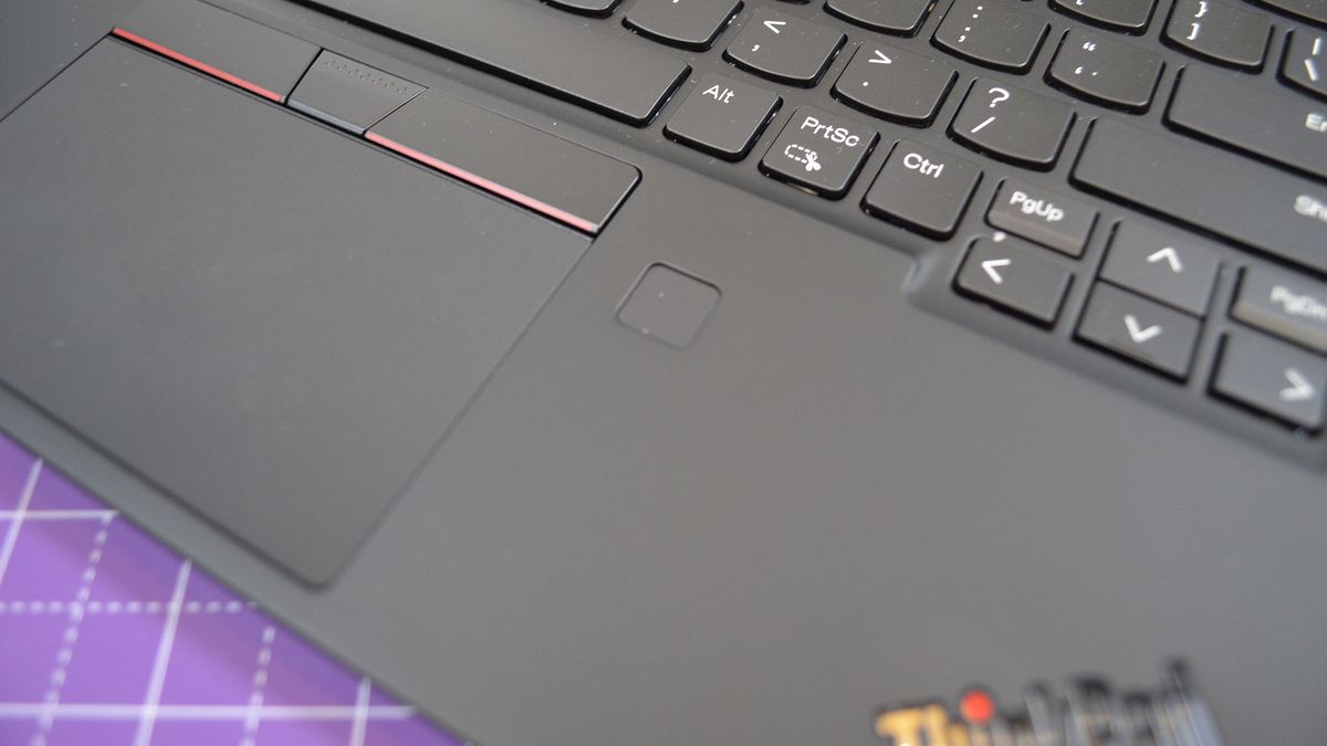 A Lenovo ThinkPad X1 Nano Gen 3 on a desk with a purple desk mat