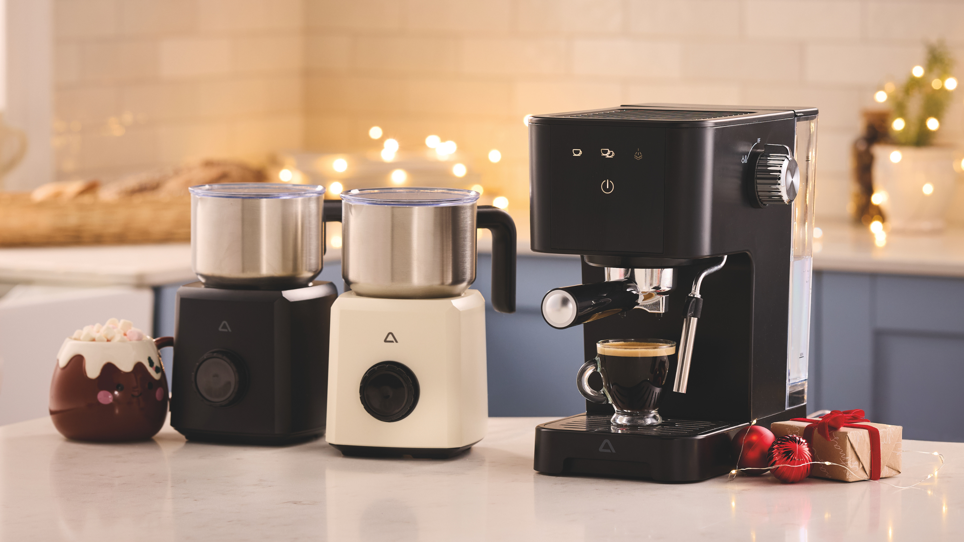 Aldi hot chocolate maker and espresso machine on a white kitchen island.
