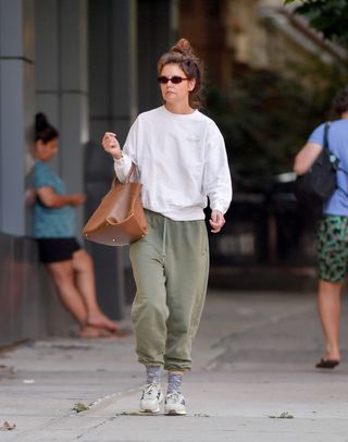 Katie Holmes walks around New York in adidas sneakers