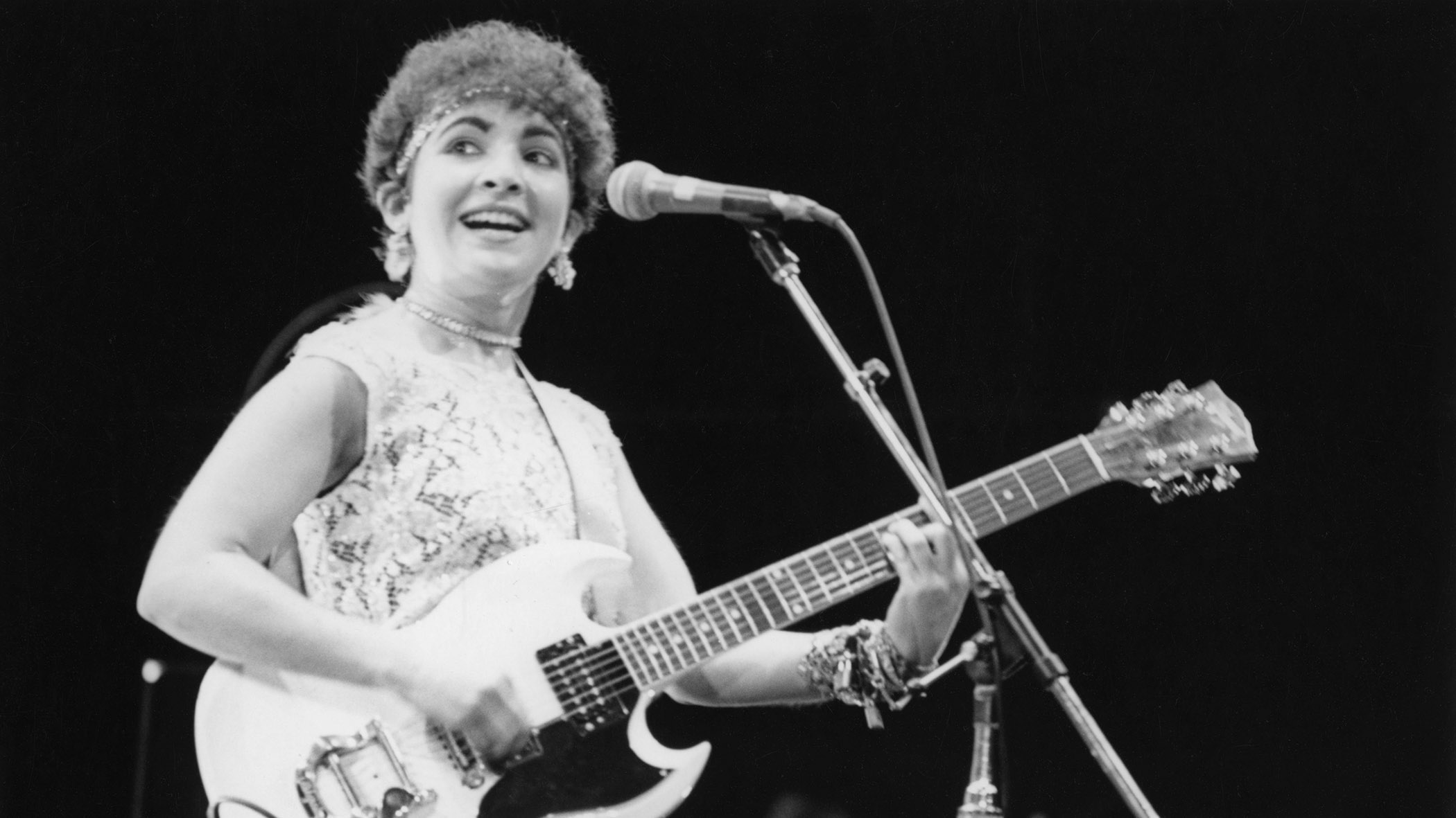 Jane Wiedlin of the Go-Go's onstage in 1980 with a Gibson SG.