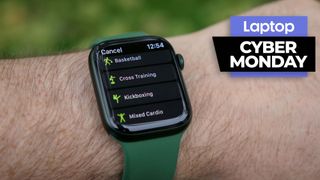 Apple Watch 7 on wrist showing exercise types with Cyber Monday deal badge