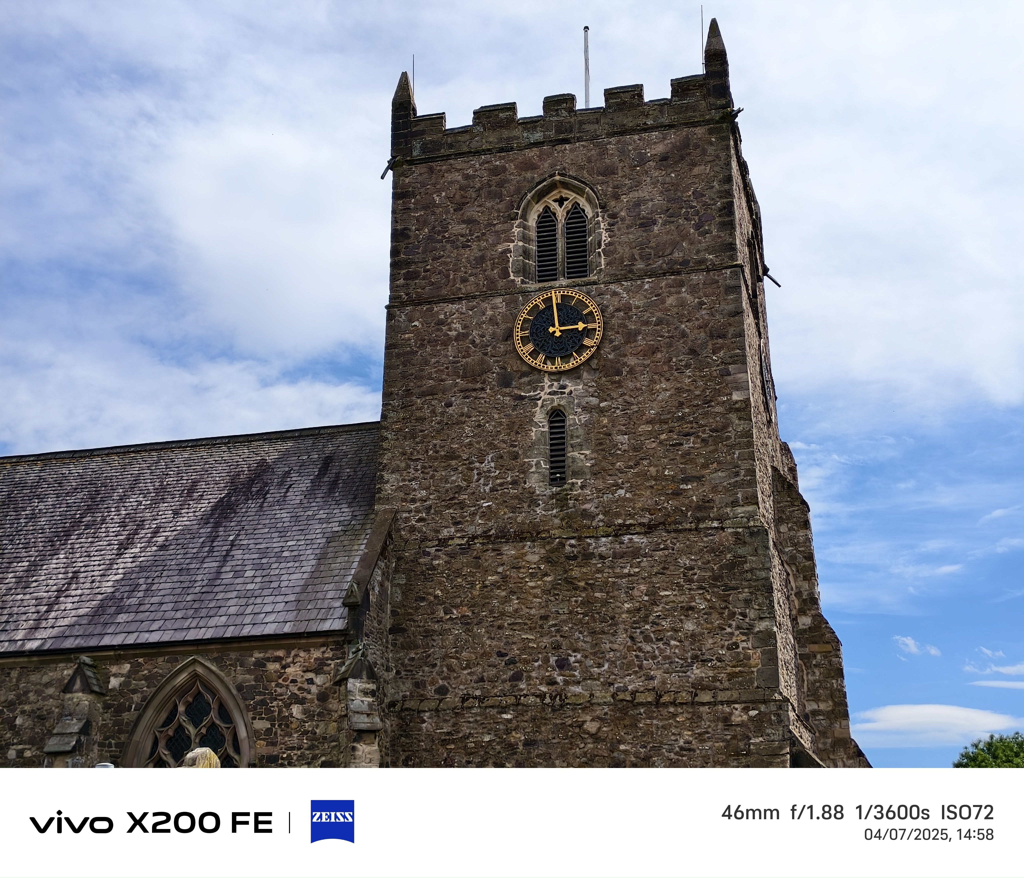 Church spire in front of a blue sky