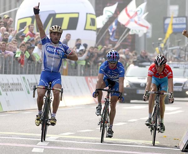 Italy's Olympic champion Paolo Bettini, left, looks at his