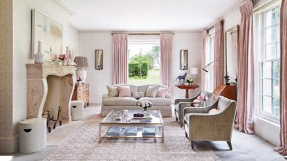 living room with pink soft furnishings