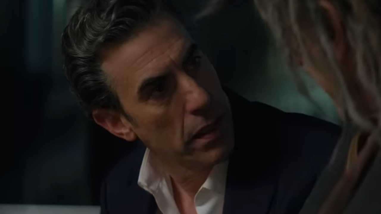 Sacha Baron Cohen talking to Richard E. Grant in Ladies First.