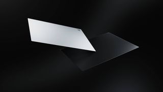 Two Razer Atlas Pro glass mouse pads floating in the void.