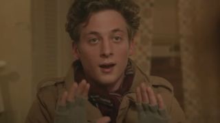 Jeremy Allen White holding his hands up as Lip in Shameless.