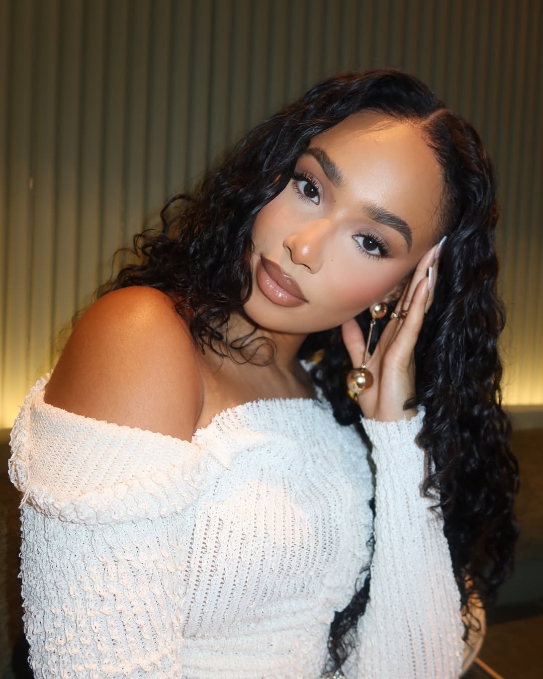 Content creator Symphani Soto wears a makeup look with winged liner.