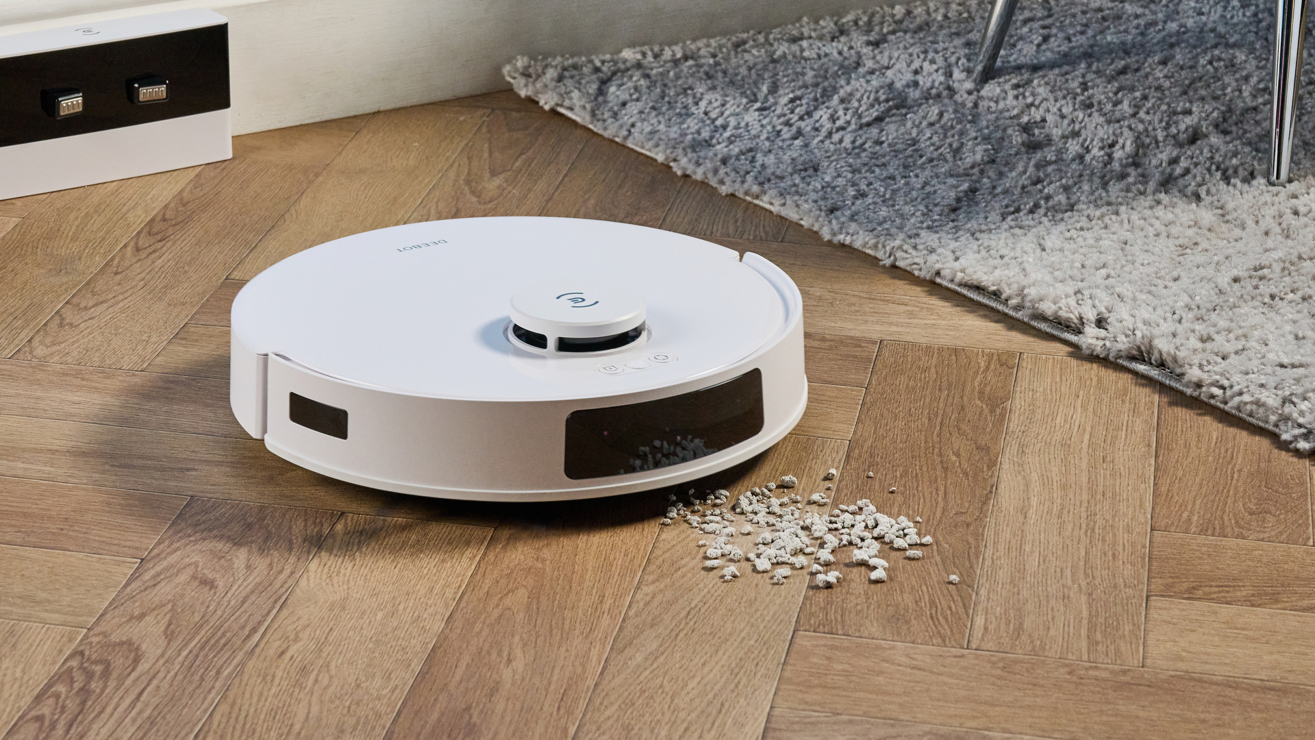 Ecovacs Deebot N20 in white photographed vacuuming floor