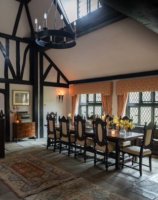 table dining hall with William Morris light and arts and crafts details in Elizabethan manor - Britain's oldest home