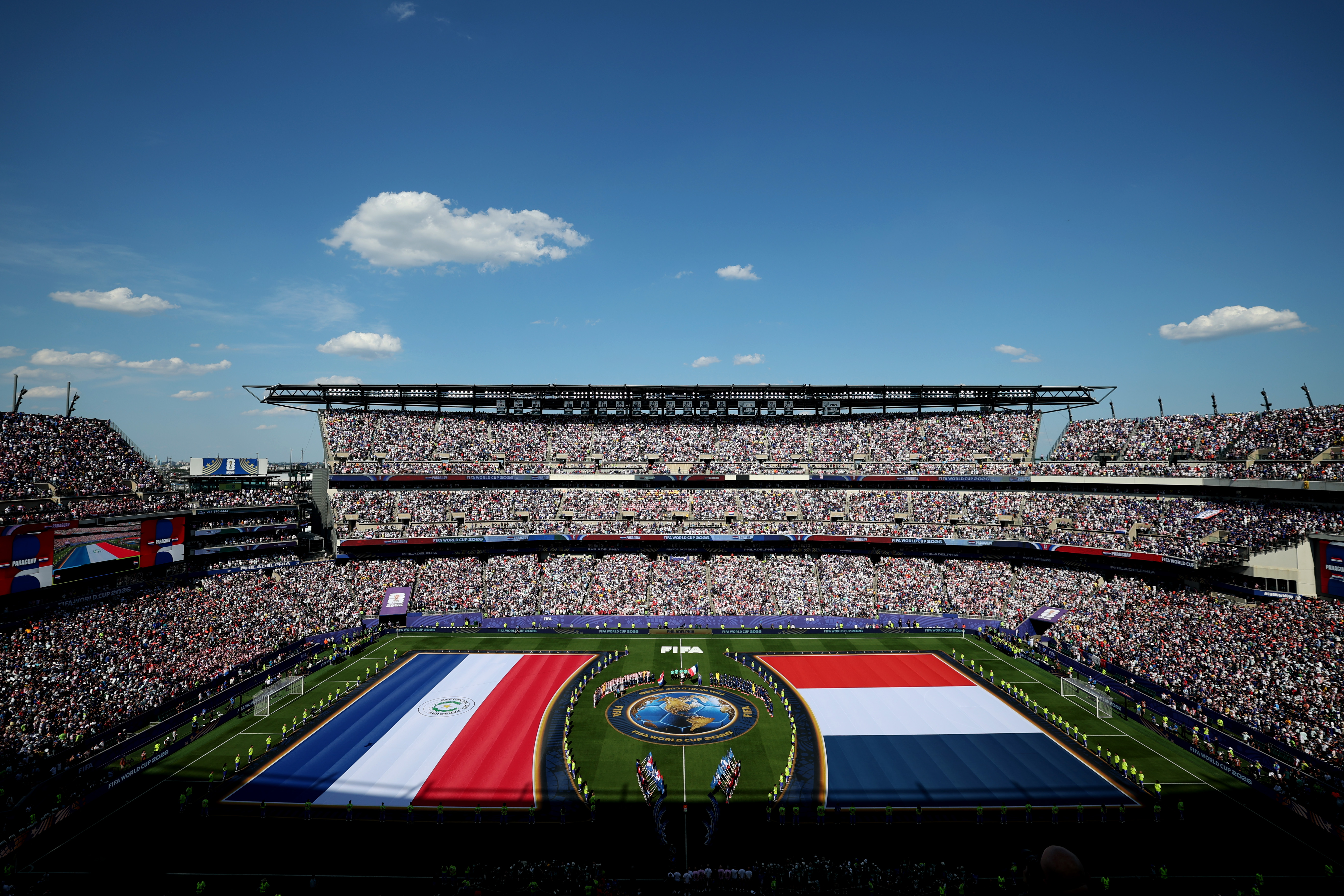 PHILADELPHIA, PENNSYLVANIA - JULY 04: Players and match officials line up before the FIFA World Cup 2026 Round of 16 match between Paraguay and France at Philadelphia Stadium on July 04, 2026 in Philadelphia, Pennsylvania. (Photo by Steph Chambers - FIFA/FIFA via Getty Images)