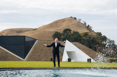 Jean-Charles Boisset standing outside of newly acquired Artesa winery next to the pool