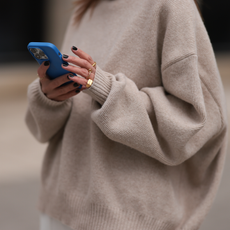 Elise Seitz seen wearing Soho Studios beige oversized wool knit sweater, on April 20, 2024 in Hamburg, Germany. (Photo by Jeremy Moeller/Getty Images)