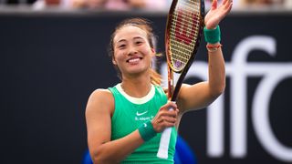Qinwen Zheng applauds the Australian Open crowd ahead of the Zheng vs Wang live stream