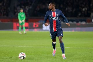 PARIS, FRANCE - DECEMBER 15: Nuno Mendes of PSG during the Ligue 1 football match between Paris Saint-Germain (PSG) and Olympique Lyonnais (OL, Lyon) at Parc des Princes stadium on December 15, 2024 in Paris, France. (Photo by Jean Catuffe/Getty Images)