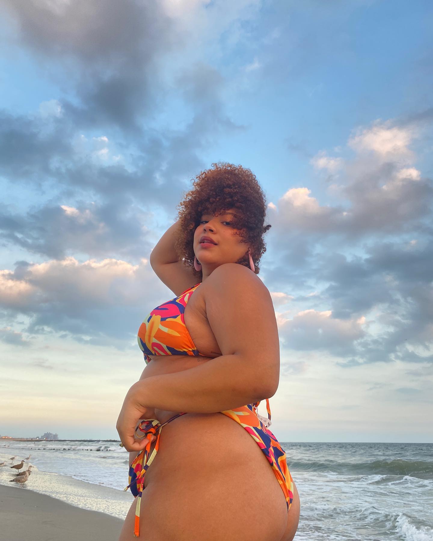 @anaasmood on the beach in a colourful bikini