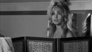 Brigitte Bardot changes her clothes in a room in La Verite