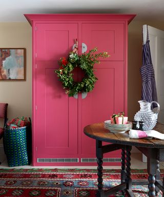 Fall wreath hanging on kitchen cabinet door