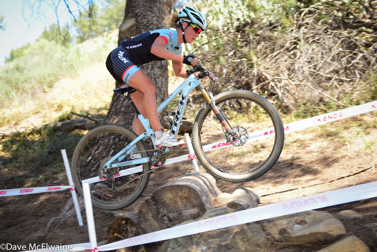 Emily Batty (Trek Factory Racing) having no trouble with the log obstacles.