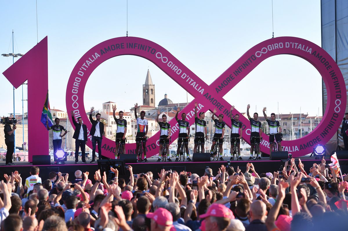 Dimension Data wave from the podium
