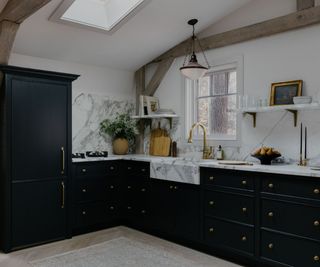 Black kitchen with marble worktops