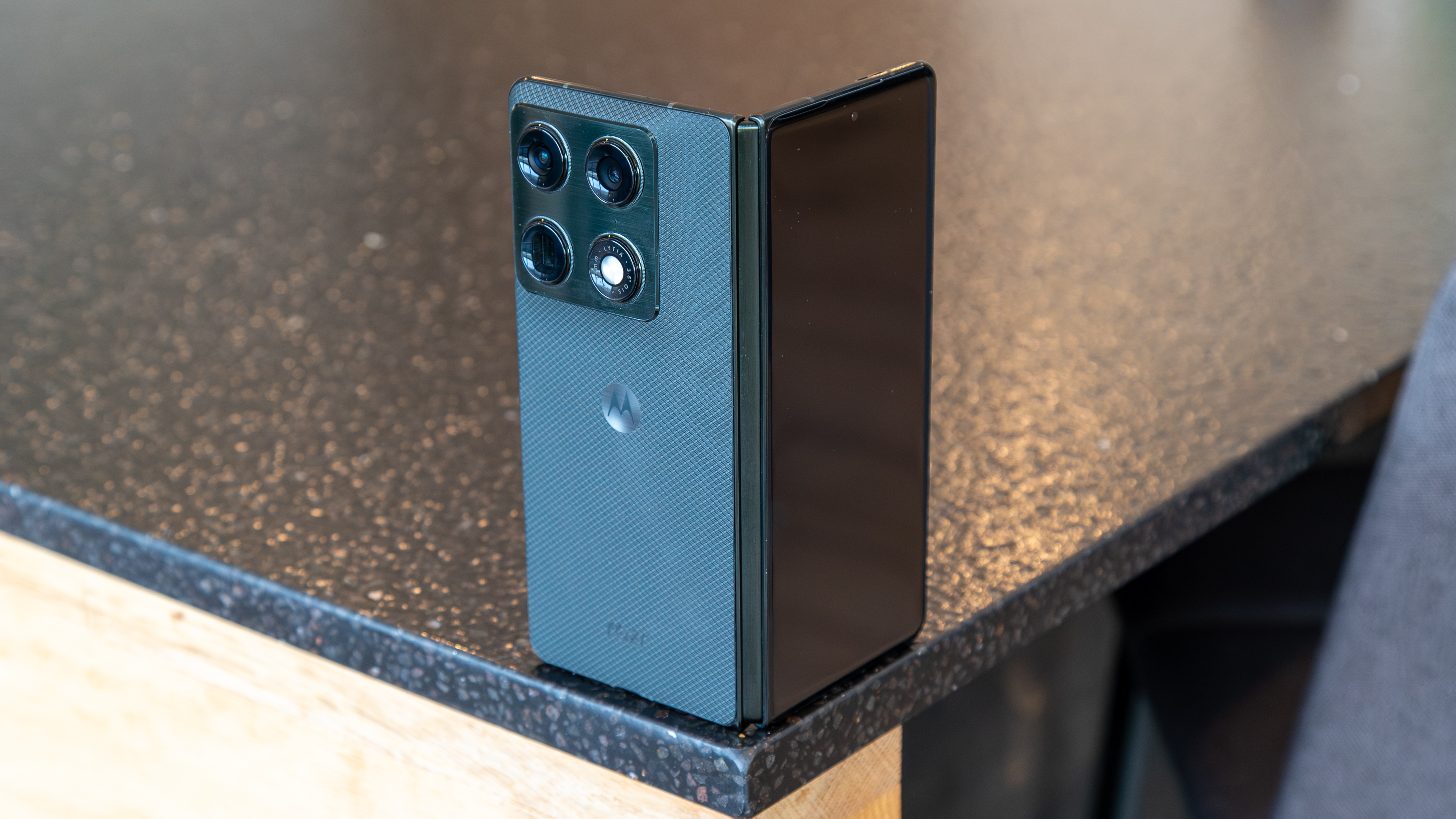 Motorola Razr Fold open on the corner of a table