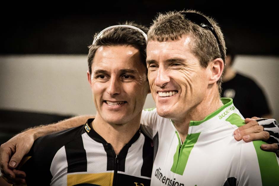 A member of Dimension Data poses for a photo with team manager Doug Ryder
