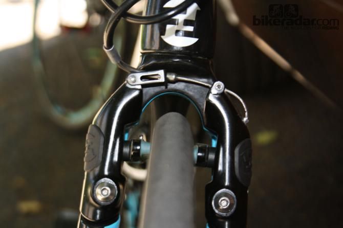 Straight pull brakes are recessed into the front fork