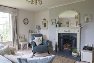 blue chair in living room in 18th century home