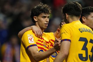 Joao Felix (left) celebrates with his Barcelona team-mates after scoring against Atletico Madrid in March 2024.