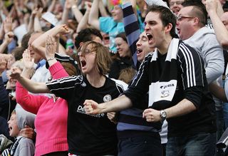 BLACKBURN, UNITED KINGDOM - MAY 03: Derby County fans celebrate Kenny Millers goal during the Barclays Premier League match between Blackburn Rovers and Derby County at Ewood Park on May 3, 2008 in Blackburn, England. (Photo by Matthew Lewis/Getty Images)