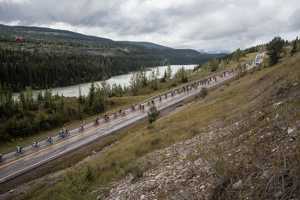 The peloton single file during stage 3 at the Tour of Alberta
