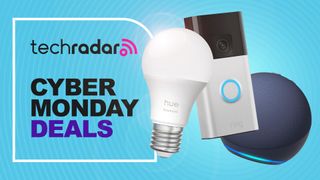 Philips Hue light bulb, Ring doorbell, and Amazon Echo speaker on blue background with text 'TechRadar Cyber Monday deals'