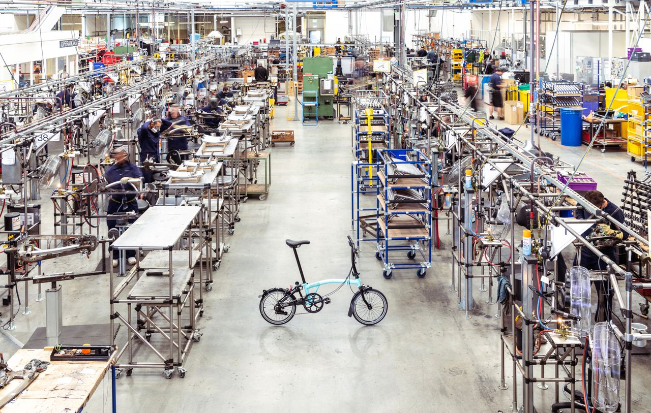 A brompton bike in a warehouse