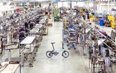 A brompton bike in a warehouse