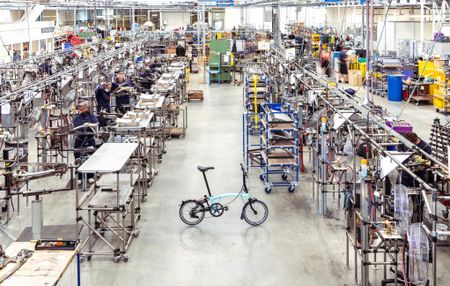 A brompton bike in a warehouse