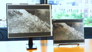 Two e-paper displays sitting side by side on a table