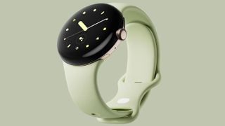 Google Pixel Watch with light green band on light green background