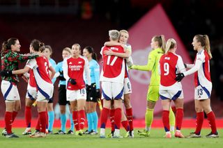 Leah Williamson of Arsenal embraces team mate Lina Hurtig of Arsenal after the UEFA Women's Champions League match between Arsenal FC and Juventus FC at the Arsenal Stadium on November 21, 2024 in London, England.