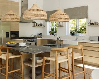 large kitchen with island and wooden bar stools