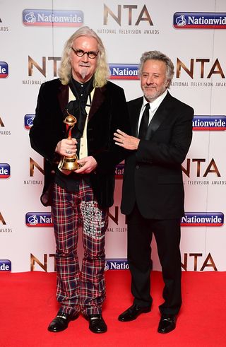 Dustin Hoffman presents Billy Connolly with the Special Recognition Award in the press room at the National Television Awards 2016 (Ian West)